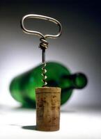 corkscrew with corks removed close-up photo