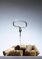 corkscrew with corks removed close-up photo