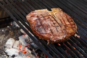 Florentine steak on the grill photo