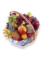 basket with grapes, orange, pineapple, mango, bananas and other fruits on white background photo