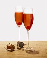 Kyr Royale, drink with red fruits, liqueur and champagne photo