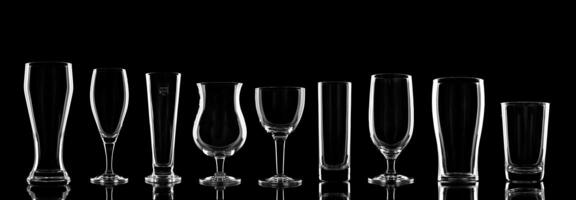 empty beer glasses specific to the type of beer on a black background photo