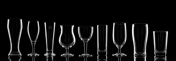 empty beer glasses specific to the type of beer on a black background photo