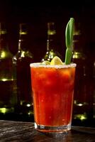 Bloody Mary, classic drink with tomato juice, vodka, lemon juice and pepper photo