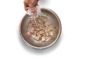 step-by-step guide to Ceviche, a classic Peruvian dish with raw fish, tiger milk sauce, lemon, pepper and red onions photo