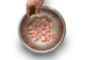 step-by-step guide to Ceviche, a classic Peruvian dish with raw fish, tiger milk sauce, lemon, pepper and red onions photo
