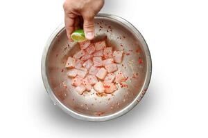 step-by-step guide to Ceviche, a classic Peruvian dish with raw fish, tiger milk sauce, lemon, pepper and red onions photo
