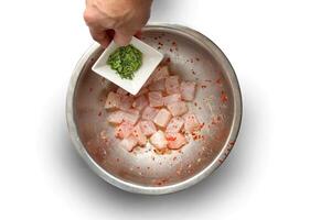 step-by-step guide to Ceviche, a classic Peruvian dish with raw fish, tiger milk sauce, lemon, pepper and red onions photo