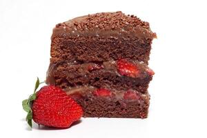 chocolate slices and cakes with cream and strawberry photo