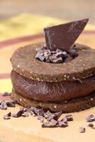 chocolate chip cookie sandwich with 100 percent cocoa chocolate cream photo