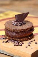 chocolate chip cookie sandwich with 100 percent cocoa chocolate cream photo