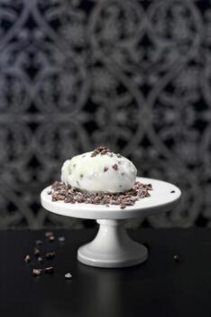 white chocolate ice cream with cocoa nibs photo
