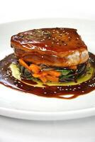 pork loin with vegetables and oriental sauce photo