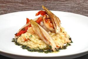 grilled shrimp with cheese risotto and endive au gratin photo