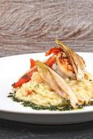 grilled shrimp with cheese risotto and endive au gratin photo