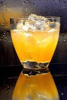 Cheetah, drink with gin, liqueur, peach tea, lemon and ice photo