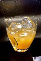 Cheetah, drink with gin, liqueur, peach tea, lemon and ice photo