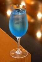 Tequila Blue, classic drink with tequila, curacau blue and lemon juice photo