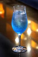 Tequila Blue, classic drink with tequila, curacau blue and lemon juice photo