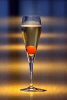 Champagne Cocktail, classic drink with champagne, angustura and sugar cube photo