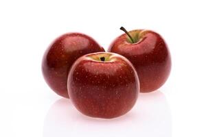 red wet Fuji apple on white background photo
