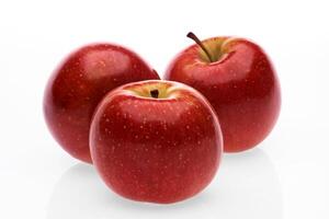 red wet Fuji apple on white background photo