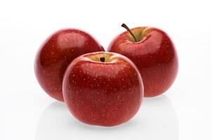 red wet Fuji apple on white background photo