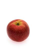 red wet Fuji apple on white background photo