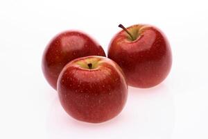 red wet Fuji apple on white background photo