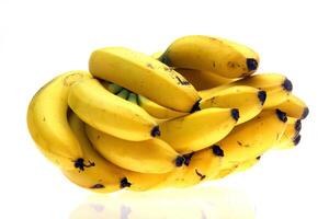 dwarf banana in bunches and separated, with skin and without photo