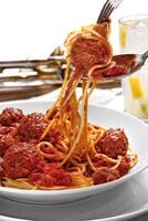 spaghetti in tomato sauce with meatballs photo