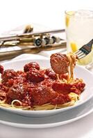 spaghetti in tomato sauce with meatballs photo