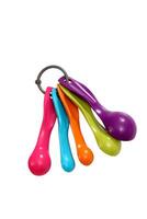 colorful kitchen utensils for children on neutral background photo