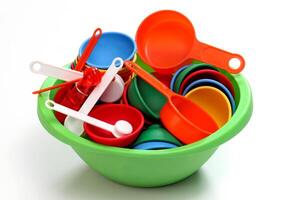 colorful kitchen utensils for children on neutral background photo