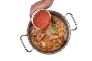 Chicken Marengo step by step, French recipe with chives, bouquet garni, carrots, orange juice and garlic among others photo
