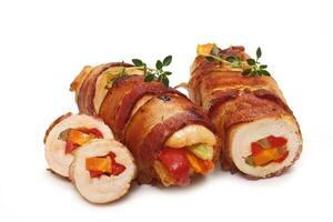 chicken fillet wrapped in bacon and stuffed with vegetables photo