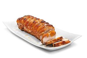 roasted and sliced pork loin on tray photo