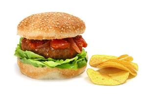 burger with tomato sauce, lettuce and fries photo
