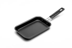 empty pan with black background on white background photo