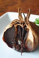 Black garlic, common garlic that has been matured in a pan for many days, very good for health photo