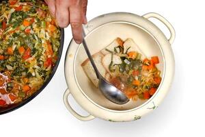 Tuscan Ribollita soup step by step with white beans, celery, chard, onions and olive oil photo