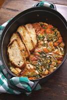 Tuscan Ribollita soup step by step with white beans, celery, chard, onions and olive oil photo