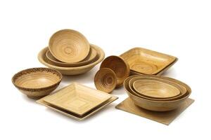 wooden cups, platters and trays on white background photo