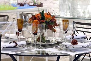 sophisticated tables with plates, cutlery and fine glasses close-up photo