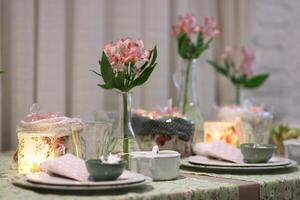 sophisticated tables with plates, cutlery and fine glasses close-up photo