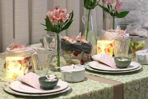 sophisticated tables with plates, cutlery and fine glasses close-up photo