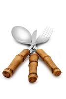 full and fine cutlery on white background photo