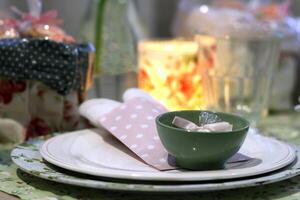 sophisticated tables with plates, cutlery and fine glasses close-up photo