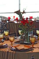 sophisticated table arrangements with yellow jackfruit glasses photo