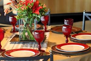 sophisticated table arrangements with red jackfruit glasses photo